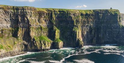 A view of the Cliffs of Moher in Ireland on a sunny day.